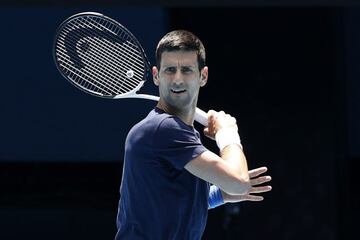 MELBOURNE, AUSTRALIA - JANUARY 12: Novak Djokovic of Serbia plays a forehand shot during a practice session ahead of the 2022 Australian Open at Melbourne Park on January 12, 2022 in Melbourne, Australia. (Photo by Darrian Traynor/Getty Images)