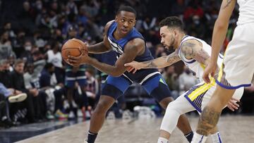 Jan 16, 2022; Minneapolis, Minnesota, USA; Minnesota Timberwolves guard McKinley Wright IV (25) works around Golden State Warriors guard Chris Chiozza (2) in the fourth quarter at Target Center. Mandatory Credit: Bruce Kluckhohn-USA TODAY Sports