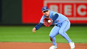 Oct 15, 2025; Seattle, Washington, USA; Toronto Blue Jays second baseman Andrés Giménez (0) turns a double play during the seventh inning against the Seattle Mariners during game three of the ALCS round for the 2025 MLB playoffs at T-Mobile Park. Mandatory Credit: Steven Bisig-Imagn Images