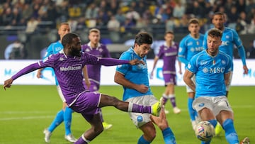 Fiorentina's French forward #11 Jonathan Ikone (L) shoots the ball during the Italian Super Cup semi final football match between Napoli and Fiorentina at Al-Awwal Park Stadium in Riyadh, on January 18, 2024. (Photo by Fayez NURELDINE / AFP)