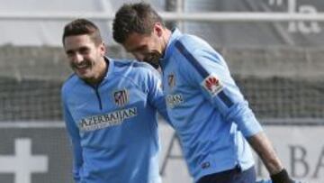 Koke y Mandzukic en el entrenamiento en Majadahonda