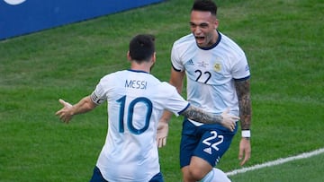 (FILES) In this file photo taken on June 28, 2019 Argentina&#039;s Lautaro Martinez (R) celebrates with teammate Lionel Messi after scoring against Venezuela during their Copa America football tournament quarter-final match at Maracana Stadium in Rio de Janeiro, Brazil. - The new Argentinian national football team is trying to build new football societies that match the power of Lionel Messi and the freshness and audacity of Lautaro Martinez and other young players. (Photo by Mauro PIMENTEL / AFP)