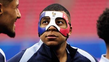 The Real Madrid attacker has been spotted with a ‘tricolore’ mask in training after breaking his nose against Austria.