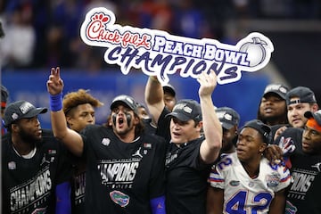 ATLANTA, GEORGIA - DECEMBER 29: The Florida Gators celebrate their teams win over the Michigan Wolverines during the Chick-fil-A Peach Bowl at Mercedes-Benz Stadium on December 29, 2018 in Atlanta, Georgia. The Gators defeated the Wolverines 41-15.