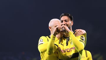 Borussia Dortmund's Algerian defender #05 Rami Bensebaini (R) celebrates after scoring his team's second goal during the UEFA Champions League, League phase - Matchday 5, football match between GNK Dinamo Zagreb and Borussia Dortmund at the Maksimir Stadium in Zagreb, on November 27, 2024. (Photo by Damir SENCAR / AFP)