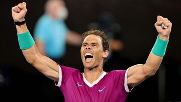 Spain&#039;s Rafael Nadal celebrates after winning the men&#039;s singles final match against Russia&#039;s Daniil Medvedev on day fourteen of the Australian Open tennis tournament in Melbourne on January 31, 2022. (Photo by Martin KEEP / AFP) / -- IMAGE 