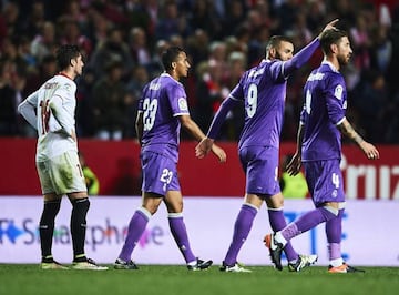 Karim Benzema celebrates after scoring the third goal at the death.