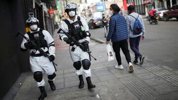 Military police officers using protective gear patrol in one of the neighbourhoods where the mayor's office decreed strict quarantine, amidst an outbreak of the coronavirus disease (COVID-19), in Bogota, Colombia July 14, 2020. REUTERS/Luisa Gonzalez