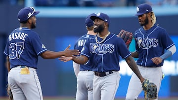 TORONTO, CANADA - SEPTEMBER 30: Osleivis Basabe #37 and Randy Arozarena #56 of the Tampa Bay Rays celebrate their MLB game victory over the Toronto Blue Jays at Rogers Centre on September 30, 2023 in Toronto, Canada.   Cole Burston/Getty Images/AFP (Photo by Cole Burston / GETTY IMAGES NORTH AMERICA / Getty Images via AFP)