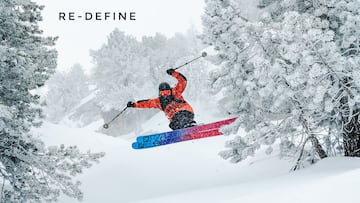 Portada de Re-Define, con el esquiador ?lvaro Penadés saltando en una monta?a muy nevada, entre árboles.