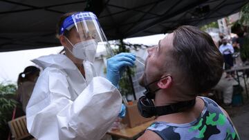 BERLIN, GERMANY - AUGUST 06: A participant submits for an express PCR test for Covid-19 outside the KiKat Club prior to taking part in an experimental, limited opening of Berlin nightclubs during the coronavirus pandemic on August 06, 2021 in Berlin, Germany. Six clubs are participating in the pilot project dubbed "Clubculture Reboot“ and have invited approximately 2,000 people to take part. Participants will undergo PCR tests today and early next week and party away throughout the weekend. The project has been launched by Berlin's Club Commission in cooperation with city authorities and Charite Hospital and is meant to help evaluate a framework for reopening Berlin's many clubs. (Photo by Sean Gallup/Getty Images)