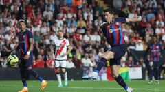 Barcelona's Polish forward Robert Lewandowski kicks the ball and scores a goal during the Spanish league football match between Rayo Vallecano de Madrid and FC Barcelona at the Vallecas stadium in Madrid on April 26, 2023. (Photo by Pierre-Philippe MARCOU / AFP)