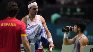 Spain's Rafael Nadal (L) and Spain's Carlos Alcaraz rest during a training ahead of the Davis Cup tennis tournament finals at the Palacio de Deportes Jose Maria Martin Carpena in Malaga, on November 18, 2024. (Photo by JORGE GUERRERO / AFP)
