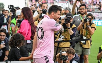 Inter Miami's Argentine forward Lionel Messi walks on th epitch with DJ Khaled' son, Asahd Khaled, at the start of the Leagues Cup Group J football match between Inter Miami CF and Atlanta United FC at DRV PNK Stadium in Fort Lauderdale, Florida, on July 25, 2023. (Photo by GIORGIO VIERA / AFP)