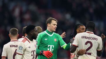 Bayern Munich's German goalkeeper #01 Manuel Neuer (C) celebrates with teammates after winning the UEFA Champions League, League phase - Matchday 5, football match between FC Bayern Munich Paris Saint-Germain (PSG) in Munich, southern Germany, on November 26, 2024. (Photo by FRANCK FIFE / AFP)
