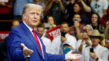 FILE PHOTO: Former U.S. President and Republican presidential candidate Donald Trump speaks on the stage at a South Dakota Republican party rally in Rapid City, South Dakota, U.S. September 8, 2023. REUTERS/Jonathan Ernst/File Photo