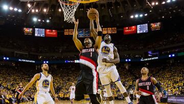 Apr 19, 2017; Oakland, CA, USA; Golden State Warriors forward Draymond Green (23) defends the shot by Portland Trail Blazers guard Evan Turner (1) during the third quarter in game two of the first round of the 2017 NBA Playoffs at Oracle Arena. The Golden State Warriors defeated the Portland Trail Blazers 110-81. Mandatory Credit: Kelley L Cox-USA TODAY Sports