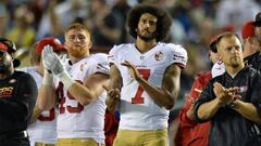 Sep 1, 2016; San Diego, CA, USA;  San Francisco 49ers quarterback Colin Kaepernick (7) and fullback Bruce Miller (49) applaud as the San Diego Chargers honor military service members during the second quarter at Qualcomm Stadium. Mandatory Credit: Jake Roth-USA TODAY Sports