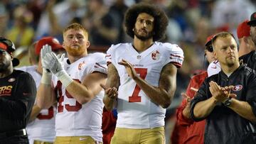 Sep 1, 2016; San Diego, CA, USA; San Francisco 49ers quarterback Colin Kaepernick (7) and fullback Bruce Miller (49) applaud as the San Diego Chargers honor military service members during the second quarter at Qualcomm Stadium. Mandatory Credit: Jake Roth-USA TODAY Sports