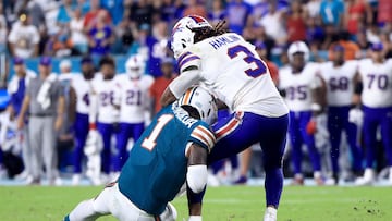 MIAMI GARDENS, FLORIDA - SEPTEMBER 12: Tua Tagovailoa #1 of the Miami Dolphins collides with Damar Hamlin #3 of the Buffalo Bills during the third quarter in the game at Hard Rock Stadium on September 12, 2024 in Miami Gardens, Florida. Carmen Mandato/Getty Images/AFP (Photo by Carmen Mandato / GETTY IMAGES NORTH AMERICA / Getty Images via AFP)