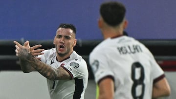 Albania's forward #7 Rey Manaj (L) celebrates scoring his team's first goal during the FIFA World Cup 2026 Group K qualification football match between Serbia and Albania at the Dubocica Stadium in Leskovac on October 11, 2025. (Photo by Andrej ISAKOVIC / AFP)