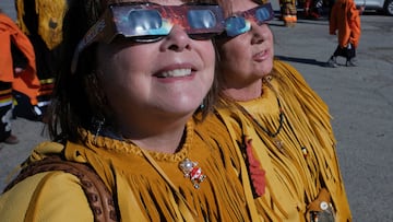 Locals from the Burgeo First Nation wear protective glasses to view a solar eclipse in Burgeo, Newfoundland, Canada April 8, 2024. REUTERS/Greg Locke