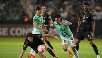 LAFC midfielder Ilie Sanchez (6) and Leon midfielder Angel Mena (13) battle for the ball