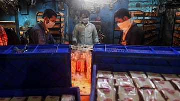 Workers at a bakery in Kolkata on April 2, 2020. 