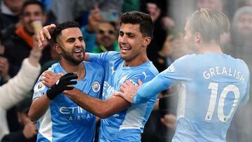 06 March 2022, United Kingdom, Manchester: Manchester City's Riyad Mahrez (L) celebrates scoring his side's third goal with teammates during the English Premier League soccer match between Manchester City and Manchester United at the Etihad Stad