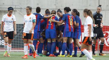 Barcelona players celebrate with goal scorer Gemma