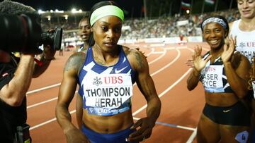 Athletics - Diamond League - Lausanne - Lausanne, Switzerland  - August 26, 2021  Jamaica&#039;s Shelly-Ann Fraser-Pryce celebrates winning the women&#039;s 100m final as Jamaica&#039;s Elaine Thompson-Herah looks dejected after finishing second REUTERS/Denis Balibouse