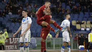 Roma's Chris Smalling , number 6, celebrates with his teammate Roma's Gianluca Mancini after scoring his side's opening goalduring the Serie A soccer match between Roma and Brescia at the Rome Olympic Stadium, Sunday, Nov. 24, 2019. (AP Pho