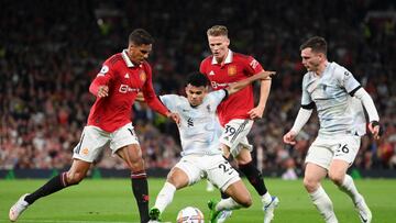 MANCHESTER, ENGLAND - AUGUST 22: Raphael Varane of Manchester United battles for possession with Luis Diaz of Liverpool during the Premier League match between Manchester United and Liverpool FC at Old Trafford on August 22, 2022 in Manchester, England. (Photo by Michael Regan/Getty Images)