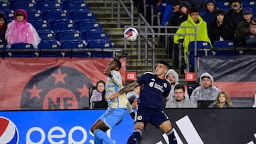 Oct 21, 2023; Foxborough, Massachusetts, USA; Philadelphia Union defender Damion Lowe (17) (left) and New England Revolution forward Gustavo Bou (7) (right) battle for the ball during the first half at Gillette Stadium. Mandatory Credit: Eric Canha-USA TODAY Sports