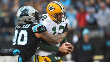 Dec 17, 2017; Charlotte, NC, USA; Carolina Panthers defensive end Julius Peppers (90) sacks Green Bay Packers quarterback Aaron Rodgers (12) in the fourth quarter at Bank of America Stadium. Mandatory Credit: Bob Donnan-USA TODAY Sports
