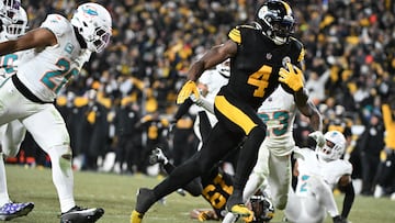 Dec 15, 2025; Pittsburgh, Pennsylvania, USA; Pittsburgh Steelers wide receiver DK Metcalf (4) runs the ball after a catch for a touchdown in the third quarter against the Miami Dolphins at Acrisure Stadium. Mandatory Credit: Barry Reeger-Imagn Images