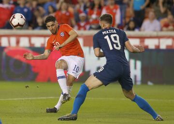 Mar 26, 2019; Houston, TX, USA; Chile midfielder Diego Vald\x8Es (10) kicks the ball away from United States of America defender Matt Miazga (19) in the first half during an international friendly soccer match at BBVA Compass Stadium. Mandatory Credit: Thomas B. Shea-USA TODAY Sports