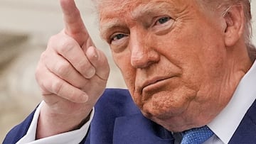FILE PHOTO: U.S. President Donald Trump gestures at the annual National Memorial Day Observance in the Memorial Amphitheater, at Arlington National Cemetery in Arlington, Virginia, U.S., May 26, 2025. REUTERS/Ken Cedeno/File Photo