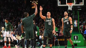 BOSTON, MA - DECEMBER 25: Marcus Smart #36 and Grant Williams #12 of the Boston Celtics high five during the game against the Milwaukee Bucks on December 25, 2022 at the TD Garden in Boston, Massachusetts. NOTE TO USER: User expressly acknowledges and agrees that, by downloading and or using this photograph, User is consenting to the terms and conditions of the Getty Images License Agreement. Mandatory Copyright Notice: Copyright 2022 NBAE (Photo by Brian Babineau/NBAE via Getty Images)