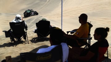 PISCO, PERU - JANUARY 08: Fans watch Monster Energy Can-Am no. 340 CAN - AM MAVERIC X3 SXS driven by Reinaldo Varela of Brazil and Gustavo Gugelmin of Brazil compete in the desert during Stage Two of the 2019 Dakar Rally between Pisco and San Juan de Marcona on January 7, 2019 in Pisco, Peru. (Photo by Dean Mouhtaropoulos/Getty Images)