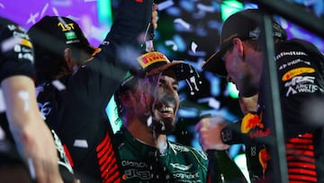 JEDDAH, SAUDI ARABIA - MARCH 19: Third placed Fernando Alonso of Spain and Aston Martin F1 Team celebrates on the podium with Race winner Sergio Perez of Mexico and Oracle Red Bull Racing and Second placed Max Verstappen of the Netherlands and Oracle Red Bull Racing during the F1 Grand Prix of Saudi Arabia at Jeddah Corniche Circuit on March 19, 2023 in Jeddah, Saudi Arabia. (Photo by Joe Portlock - Formula 1/Formula 1 via Getty Images)