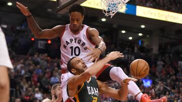 Jan 5, 2017; Toronto, Ontario, CAN; Toronto Raptors guard DeMar DeRozan (10) lands on Utah Jazz center Rudy Gobert (27) as they battle for a rebound in the fourth quarter at Air Canada Centre. The Raptors won 101-93. Mandatory Credit: Dan Hamilton-USA TODAY Sports