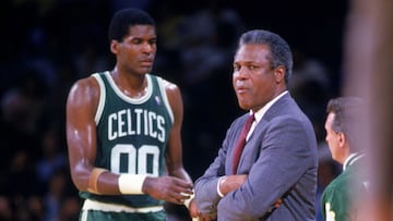 1986:  Head coach K.C. Jones of the Boston Celtics looks on from the sidelines as Robert Parish #00 of the Celtics stands in the background during a game in the 1986-1987 NBA season.  K.C. Jones was the head coach of the Boston Celtics from 1983-1988.  (Photo by Getty Images)
