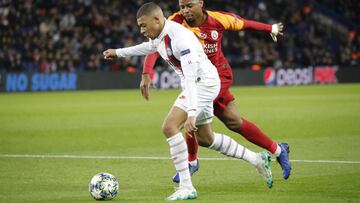 December 11 2019 - Paris, France : Soccer Champion&#039;s League Group A stage phase PSG vs Galatasaray in Parc des Princes stadium. PSG won 5-0. PSG&#039;s (white shirt) Kylian Mbappe battling Galatasaray&#039;s (red-yellow shirt) Ryan Donk seen here. (H