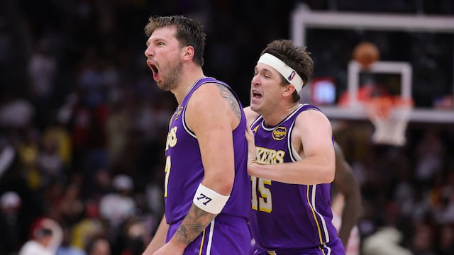 HOUSTON, TEXAS - MARCH 18: Austin Reaves #15 of the Los Angeles Lakers celebrates with Luka Doncic #77 of the Los Angeles Lakers during the second half against the Houston Rockets at Toyota Center on March 18, 2026 in Houston, Texas. NOTE TO USER: User expressly acknowledges and agrees that, by downloading and or using this photograph, User is consenting to the terms and conditions of the Getty Images License Agreement. Alex Slitz/Getty Images/AFP (Photo by Alex Slitz / GETTY IMAGES NORTH AMERICA / Getty Images via AFP)
