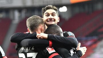 Soccer Football - Bundesliga - Bayer Leverkusen v Borussia Dortmund - BayArena, Leverkusen, Germany - January 19, 2021 Bayer Leverkusen's Moussa Diaby celebrates scoring their first goal with teammates Pool via REUTERS/Martin Meissner DFL regulation