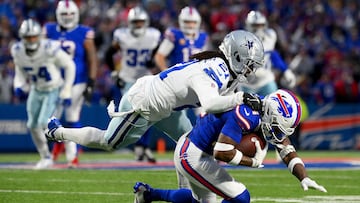 ORCHARD PARK, NEW YORK - DECEMBER 17: Stephon Gilmore #21 of the Dallas Cowboys tackles Stefon Diggs #14 of the Buffalo Bills during the first quarter at Highmark Stadium on December 17, 2023 in Orchard Park, New York. Rich Barnes/Getty Images/AFP (Photo by Rich Barnes / GETTY IMAGES NORTH AMERICA / Getty Images via AFP)