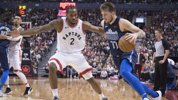 Oct 26, 2018; Toronto, Ontario, CAN; Dallas Mavericks forward Luka Doncic (77) controls a ball as Toronto Raptors forward Kawhi Leonard (2) tries to defend during the second quarter at Scotiabank Arena. Mandatory Credit: Nick Turchiaro-USA TODAY Sports