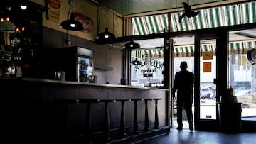 A person walks through the door at The Rough House restaurant ahead of South Carolina?s Republican presidential primary election in Abbeville, South Carolina, U.S., February 21, 2024. REUTERS/Allison Joyce