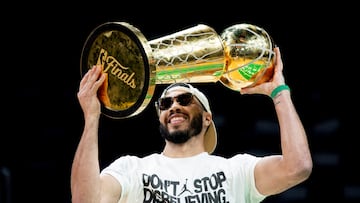 BOSTON, MASSACHUSETTS - JUNE 21: Jayson Tatum #0 of the Boston Celtics hoists the Larry O'Brien trophy as he is introduced during the Boston Celtics Victory Event following their 2024 NBA Finals win at TD Garden on June 21, 2024 in Boston, Massachusetts. Maddie Malhotra/Getty Images/AFP (Photo by Maddie Malhotra / GETTY IMAGES NORTH AMERICA / Getty Images via AFP)